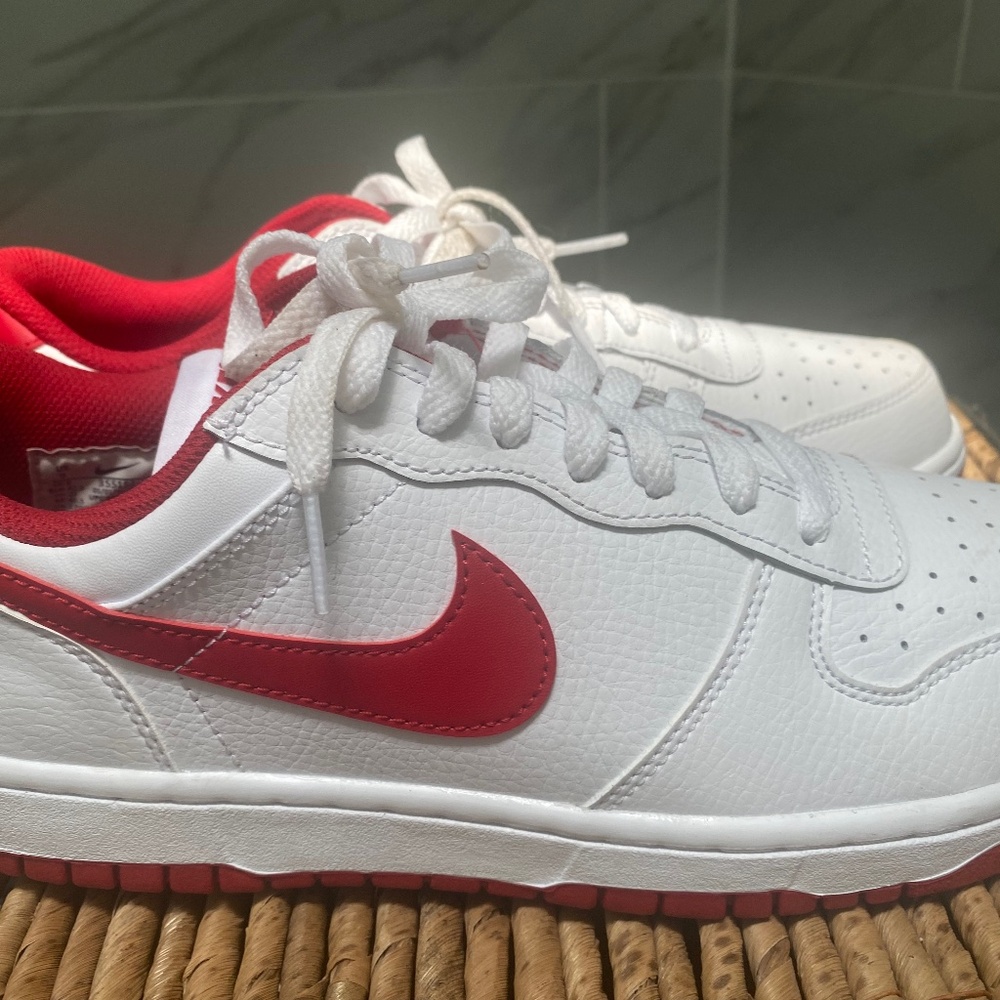 This is a Nike Dunk Low in the White/University Red colorway — often called “St